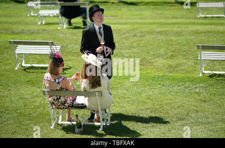 Racegoers enjoy the atmosphere during Derby Day of the 2019 Investec Derby Festival at Epsom Racecourse, Epsom. Stock Photo