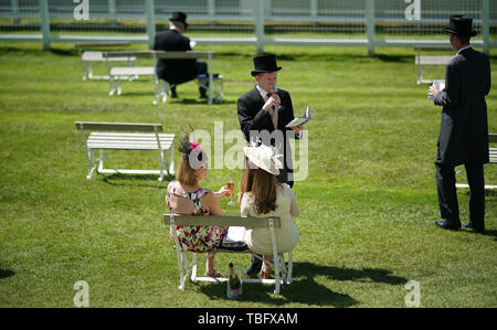 Racegoers enjoy the atmosphere during Derby Day of the 2019 Investec Derby Festival at Epsom Racecourse, Epsom. Stock Photo