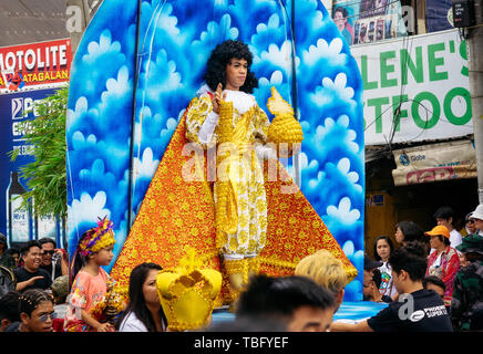 Cebu City , The Philippines - January 20, 2019: Living man in authentic costume looks like Santo Nino or Christ Child statuette at the Sinulog Festiva Stock Photo