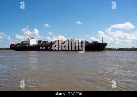 New Orleans, LA, USA -- May 24, 2019.  An MSC container ship travels along the Mississippi with cargo on board. Stock Photo