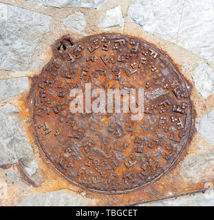Cast iron Rusty Sewer hatch Stock Photo