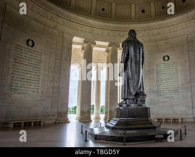 Statue of Thomas Jefferson from the rear looking at the Washington memorial, in the Jefferson Monument in Washington DC, USA on 13 May 2019