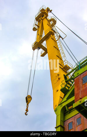 Truck crane boom with hooks and scale weight Stock Photo