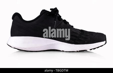 Single new unbranded black sport running shoe, sneakers or trainers ...