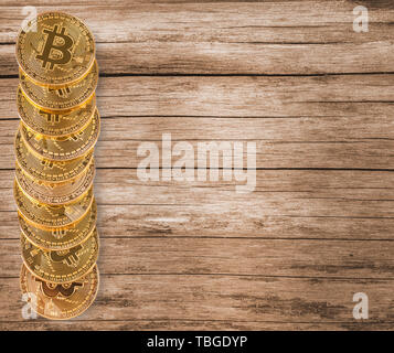 new bitcoins on wooden surface Stock Photo