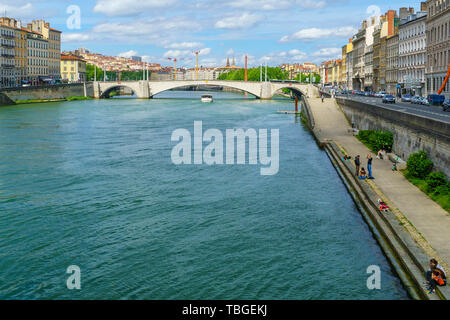 Lyon, France - May 10, 2019: View of the Saone river, with locals and visitors, in Lyon, France Stock Photo