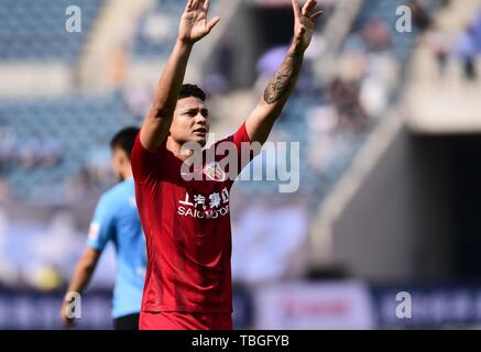 Brazilian football player Elkeson de Oliveira Cardoso, or simply Elkeson, of Shanghai SIPG celebrates after scoring against Dalian Yifang in their 12th round match during the 2019 Chinese Football Association Super League (CSL) in Dalian city, northeast China's Liaoning province, 2 June 2019. Stock Photo