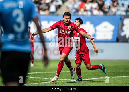 Brazilian football player Elkeson de Oliveira Cardoso, or simply Elkeson, of Shanghai SIPG celebrates after scoring against Dalian Yifang in their 12th round match during the 2019 Chinese Football Association Super League (CSL) in Dalian city, northeast China's Liaoning province, 2 June 2019. Stock Photo