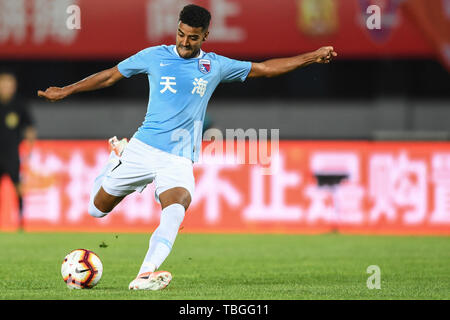 Brazilian football player Alan Douglas Borges de Carvalho, simply known as Alan, of Tianjin Tianhai dribbles against Beijing Renhe in their 12th round match during the 2019 Chinese Football Association Super League (CSL) in Beijing, China, 1 June 2019.  Beijing Renhe defeated Tianjin Tianhai 2-0. Stock Photo