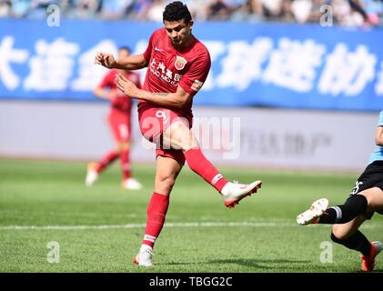 Brazilian football player Elkeson de Oliveira Cardoso, or simply Elkeson, of Shanghai SIPG shots the ball against Dalian Yifang in their 12th round match during the 2019 Chinese Football Association Super League (CSL) in Dalian city, northeast China's Liaoning province, 2 June 2019. Stock Photo