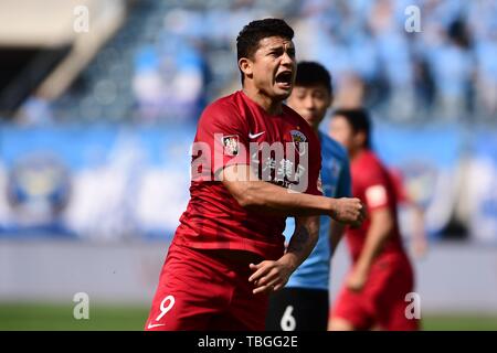 Brazilian football player Elkeson de Oliveira Cardoso, or simply Elkeson, of Shanghai SIPG celebrates after scoring against Dalian Yifang in their 12th round match during the 2019 Chinese Football Association Super League (CSL) in Dalian city, northeast China's Liaoning province, 2 June 2019. Stock Photo