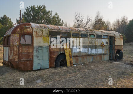 Old school bus as hideout Stock Photo