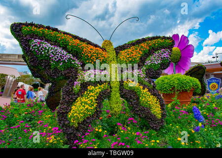 Orlando, Florida . March 27, 2019. Butterfly topiarie on lightblue cloudy sky background at  Epcot in Walt Disney World. Stock Photo