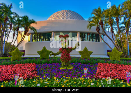 Orlando, Florida . March 27, 2019. Daisy duck topiarie on colorful scenery at Epcot in Walt Disney World  (1) Stock Photo