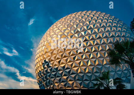 Orlando, Florida . March 27, 2019. Partial view of Sphere Spaceship Earth attraction on blue cloudy sky background at Epcot in Walt Disney World . Stock Photo
