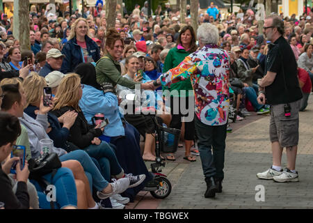 Orlando, Florida . March 27, 2019. Russell Hitchcock holding a woman's hand while singing and walking among the people at Epcot in Walt Disney World . Stock Photo