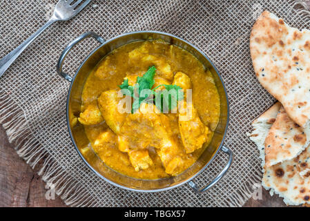 Chicken korma curry with naan bread - top view Stock Photo