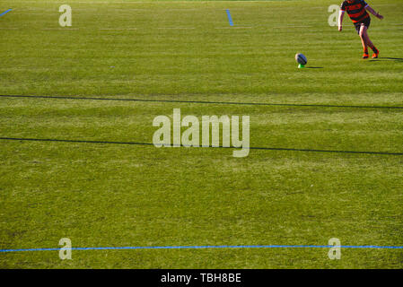 Valencia, Spain - January 19, 2019: Rugby player kicking the ball. Stock Photo