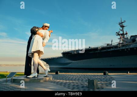 San Diego, CA - MAY 18: Unconditional Surrender sculpture at sea port on May 18, 2014 in San Diego. By Seward Johnson, the statue resembles the photograph of V–J day in Times Square Stock Photo