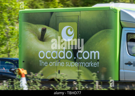 Northampton, UK - May 10th 2019: ocado home delivery van on uk motorway in fast motion. Stock Photo