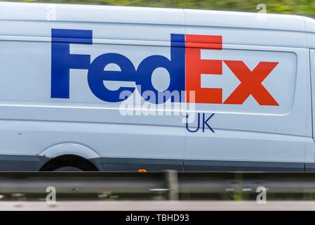 Northampton, UK - May 10th 2019: fedex uk delivery van on british motorway in motion Stock Photo