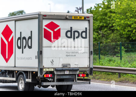 Northampton, UK - May 10th 2019: dpd delivery truck on uk motorway in fast motion Stock Photo