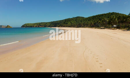 Blue sea and tropical beach, aerial drone. Nacpan, El Nido, Palawan, Philippine Islands. Seascape with tropical beach and islands. Summer and travel vacation concept Stock Photo