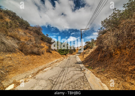 Cloudy sky over a walk path in Bronson Canyon, Los Angeles. California, USA Stock Photo