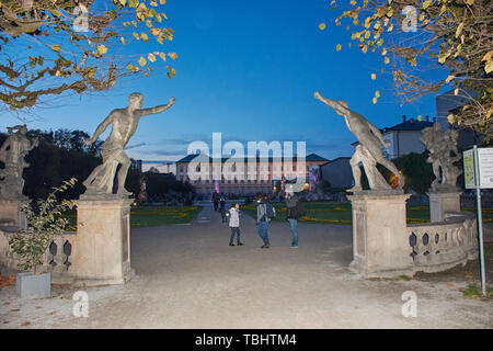 Beautiful view of Mirabell Palace and the statues in front of the gardens from it's entrance. Stock Photo