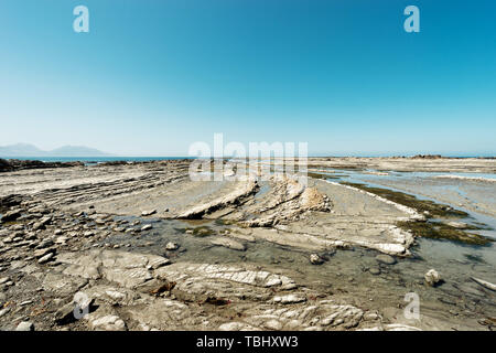 Empty rocky beach in bluesky Stock Photo