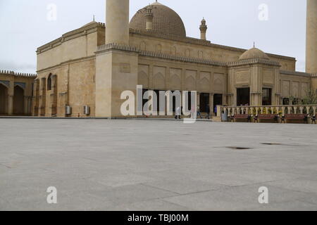 AZERBAIJAN, JUMA MOSQUE-CIRCA MAY 2019--unidentified people near the mosque Stock Photo