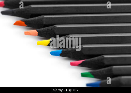 Multi-colored pencils on a white background laid out in a row. isolated Stock Photo