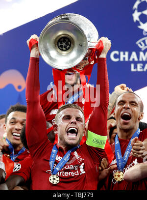 Liverpool's Jordan Henderson celebrates with the trophy after the UEFA Champions League Final at the Wanda Metropolitano, Madrid. Stock Photo