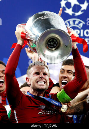 Liverpool's Jordan Henderson celebrates with the trophy after the UEFA Champions League Final at the Wanda Metropolitano, Madrid. Stock Photo