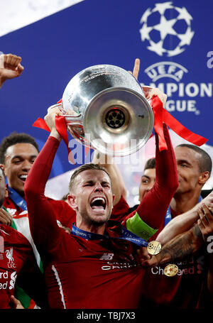 Liverpool's Jordan Henderson celebrates with the trophy after the UEFA Champions League Final at the Wanda Metropolitano, Madrid. Stock Photo