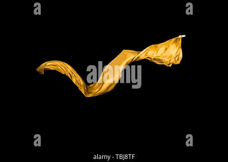 golden soft satin flying in wind on background Stock Photo