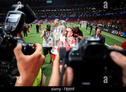 Liverpool's Jordan Henderson celebrates with the trophy after winning the UEFA Champions League Final at the Wanda Metropolitano, Madrid. Stock Photo