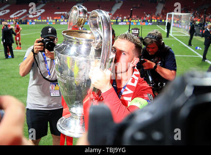 Liverpool's Jordan Henderson celebrates with the trophy after winning the UEFA Champions League Final at the Wanda Metropolitano, Madrid. Stock Photo