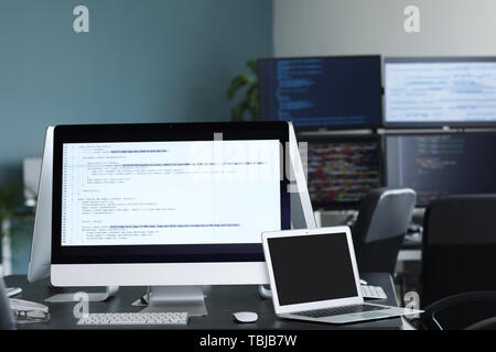 Workplace of programmer in office Stock Photo