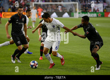 Washington DC, USA. 1st June, 2019. San Jose Earthquakes Midfielder/Defender (6) Shea Salinas and D.C. United Defender (20) Jalen Robinson get tangled up during an MLS soccer match between the D.C. United and the San Jose Earthquakes at Audi Field in Washington DC. Justin Cooper/CSM/Alamy Live News Stock Photo