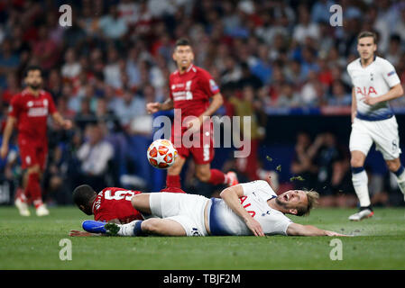 Madrid, Spain. 01st June, 2019. Harry Kane of Tottenham Hotspur is fouled by Georginio Wijnaldum of Liverpoolx during the UEFA Champions League Final match between Tottenham Hotspur and Liverpool at Wanda Metropolitano on June 1st 2019 in Madrid, Spain. (Photo by Daniel Chesterton/phcimages.com) Credit: PHC Images/Alamy Live News Stock Photo