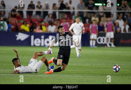 Washington DC, USA. 1st June, 2019. D.C. United Midfielder (8) Ulises Segura is taken down by San Jose Earthquakes Midfielder (20) Anibal Godoy during an MLS soccer match between the D.C. United and the San Jose Earthquakes at Audi Field in Washington DC. Justin Cooper/CSM/Alamy Live News Stock Photo