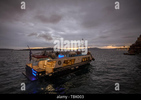 SANTORINI GREECE - OCTOBER 24 2018: Boat waiting to take tourists on the cruise ship Stock Photo