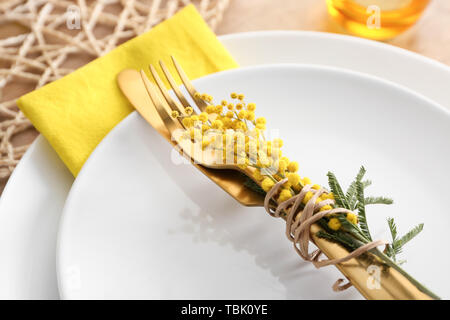 Beautiful table setting with mimosa flowers, closeup Stock Photo