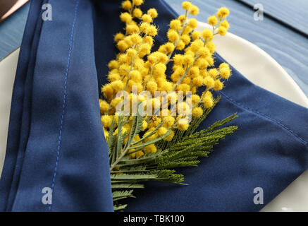 Beautiful table setting with mimosa flowers, closeup Stock Photo