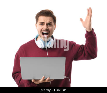 Stressed male programmer with laptop on white background Stock Photo