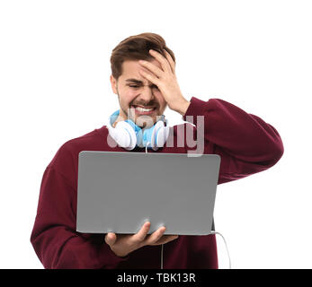 Stressed male programmer with laptop on white background Stock Photo