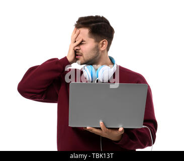 Stressed male programmer with laptop on white background Stock Photo