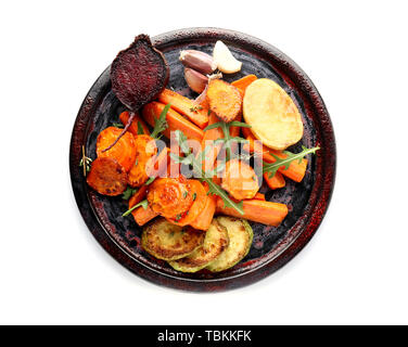 Plate with tasty cooked vegetables on white background Stock Photo