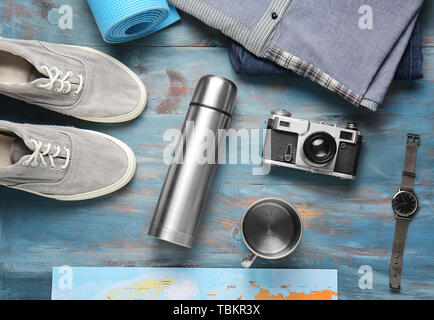 Set of items for tourist on wooden background Stock Photo